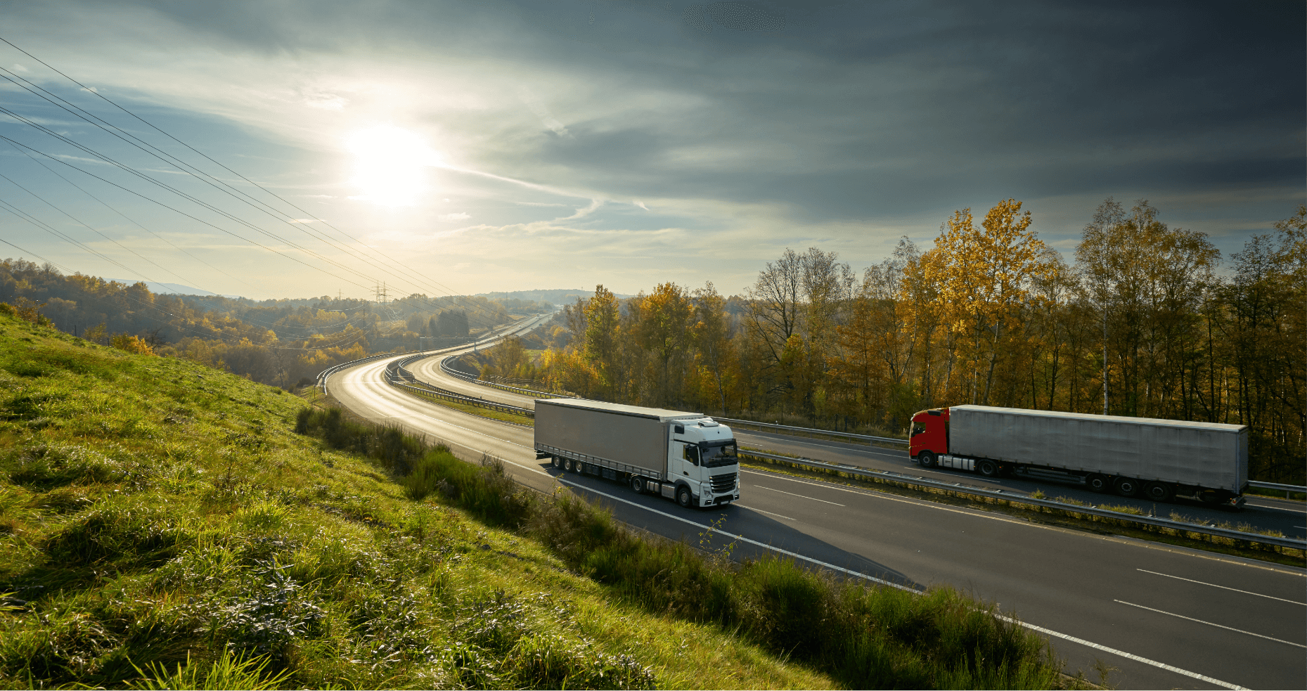 truck driving with a sunset in the distance